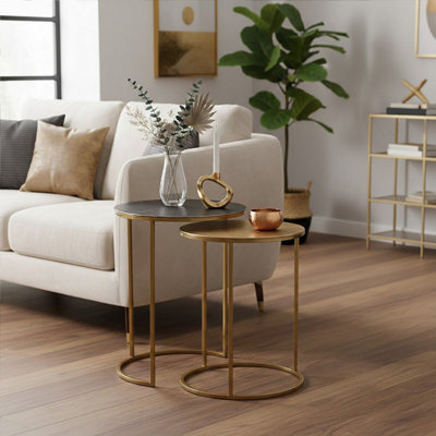 Orsina Nest Of Two Gold TablesSpace-Saving Modern Nesting TablesZinc Table Tops With Gold Base from B&Q