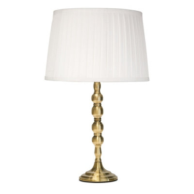 Lighting Supermarket Bergen Slimline Antique Brass Candlestick Table Lamp With Ivory Pleated Shade