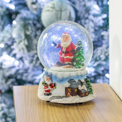The Christmas Workshop 70779 Musical Snow Globe With Snowboarding Santa Design from B&Q