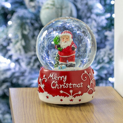 The Christmas Workshop 70939 Musical Snow Globe With Traditional Santa Claus Design from B&Q