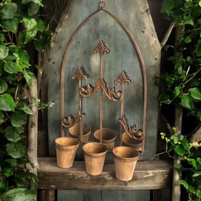 75Cm Rusty Wall Mirror With Triple Planter from B&Q