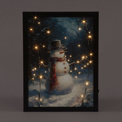 Snowtime B/o F/o 30X40Cm Framed Canvas Snowman In Hat & Scarf from B&Q