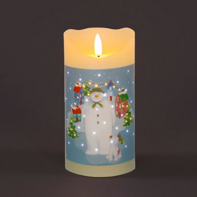 Snowtime Christmas Candle With Snowman And Snowdog Village Scene from B&Q