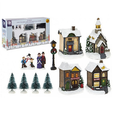 PMS 12 Piece Mini Light Up Village Christmas Scene Resin Houses Figurines With Trees from B&Q