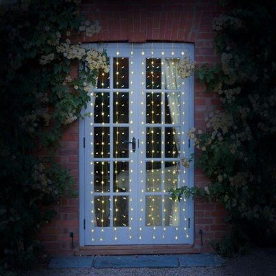 Smart Solar Eureka Curtain Lights Mains-Powered Warm White 256 Led Indoor & Outdoor String Lights from B&Q