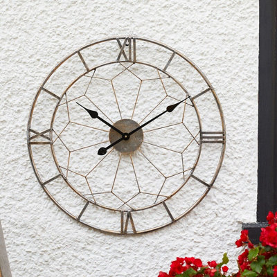 London Indoor Or Outdoor Wall ClockBattery Powered Weather Resistant Round Metal Roman Numeral Quartz Skeleton Clock60Cm Dia from B&Q