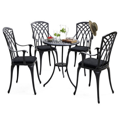 Homeology Oshowa Garden And Patio Table And 4 Large Chairs With Armrests Cast Aluminium Bistro SetBlack Cushions from B&Q