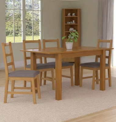Hallowood Furniture Camberley Oak Butterfly Extending Dining Table With 4 Ladder Back Chairs In Light Grey Fabric Seats from B&Q
