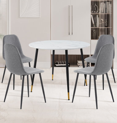 Hallowood Furniture Finley Small Round Dining Table In Marble Finish With 4 Dark Grey Fabric Chairs from B&Q