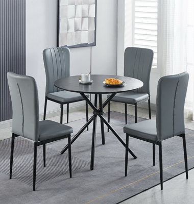 Hallowood Furniture Cullompton Small Black Round Dining Table 90Cm With 4 Light Grey Faux Leather Chairs from B&Q