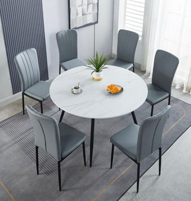 Hallowood Furniture Cullompton Large Round Dining Table 120Cm With 6 Light Grey Faux Leather Chairs from B&Q