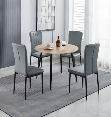 Hallowood Furniture Cullompton Small Round Dining Table 90Cm With 4 Faux Leather Grey Chairs from B&Q