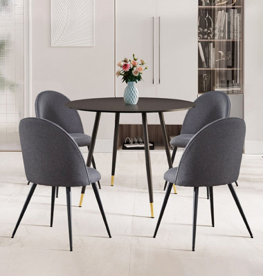 Hallowood Furniture Finley Small Round Dining Table In Black Finish With 4 Curved Back Grey Fabric Chairs from B&Q