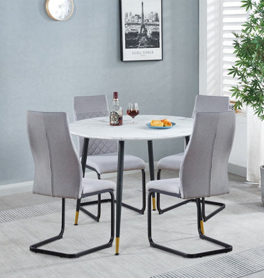 Hallowood Furniture Finley Small Round Dining Table In White Marble Finish With 4 High Back Light Grey Fabric Chairs from B&Q