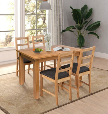 Hallowood Furniture Camberley Oak Butterfly Extending Dining Table With 4 Ladder Back Oak Chair With Charcoal Seat Pads from B&Q