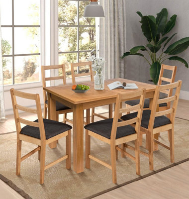 Hallowood Furniture Camberley Oak Butterfly Extending Dining Table With 6 Ladder Back Oak Chair With Charcoal Seat Pads from B&Q