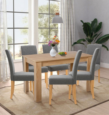 Hallowood Furniture Newquay Oak Fixed Top Table 120Cm With 6 Straight Back Grey Fabric Chairs from B&Q