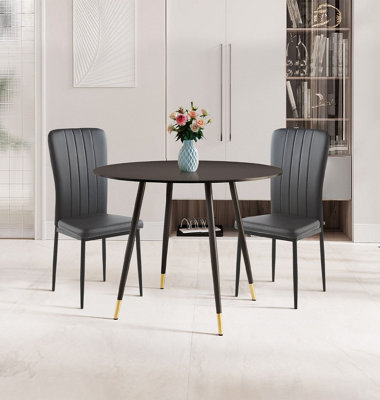 Hallowood Furniture Finley Small Round Dining Table In Black Finish With 2 Black Faux Leather High Back Chairs from B&Q