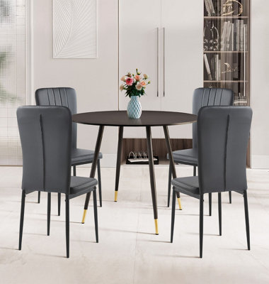 Hallowood Furniture Finley Small Round Dining Table In Black Finish With 4 Black Faux Leather High Back Chairs from B&Q