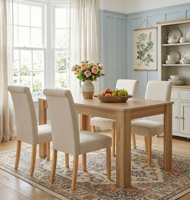 Hallowood Furniture Newquay Oak Fixed Top Table 120Cm With 4 Roll Top Cream Fabric Chairs from B&Q