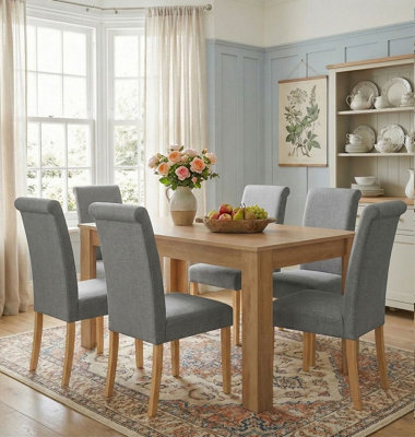 Hallowood Furniture Newquay Oak Fixed Top Table 120Cm With 6 Roll Top Steel Grey Fabric Chairs from B&Q