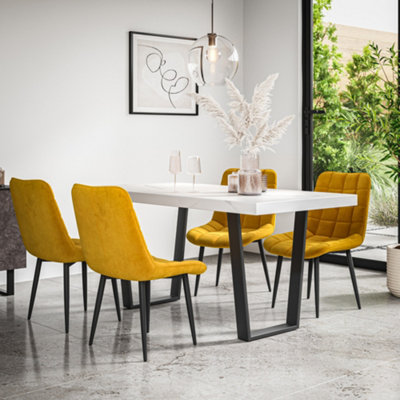 More4Homes Aria Dining Table And Chairs White Marble Effect Table Top W Black Legs + Nova Velvet Dining Chair Set Of 4 (Mustard) from B&Q