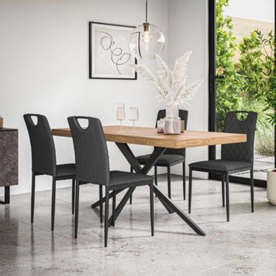 More4Homes Donni Dining Table And Chairs Oak Effect Table Top W Black Legs + Monza Linen Dining Chair Set Of 4 (Charcoal) from B&Q
