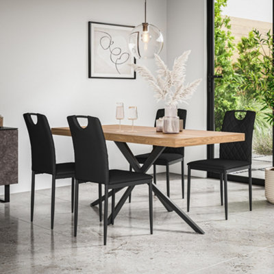 More4Homes Donni Dining Table And Chairs Oak Effect Table Top W Black Legs + Monza Faux Leather Dining Chair Set Of 6 (Black) from B&Q