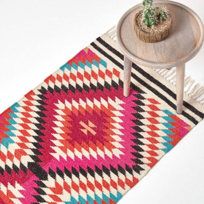 Homescapes Manila Handwoven PinkOrange And White Multi Coloured Diamond Patterned Kilim Wool Rug66 X 200 Cm from B&Q