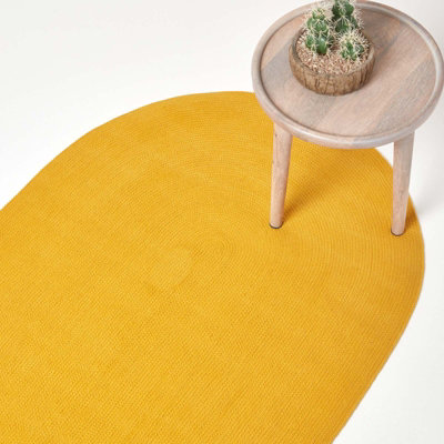 Homescapes Mustard Handmade Woven Braided Oval Rug, 60 X 90 Cm Yellow