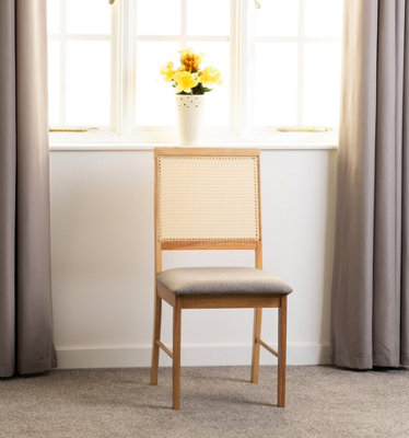 Seconique Ellis Pair Of Chairs In Oak Effect With Rattan Back And Grey Fabric from B&Q