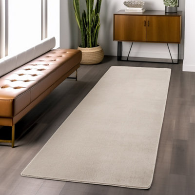 Snuggly Washable Low Pile Living Room Area Rug  Anti Slip Felt Backing Cream 60 X 200 Cm (Runner) from B&Q