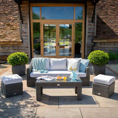Primrose Living Classic Rattan 5 Seater Garden Furniture Sofa Set With Coffee Table And Footstools In Stone from B&Q