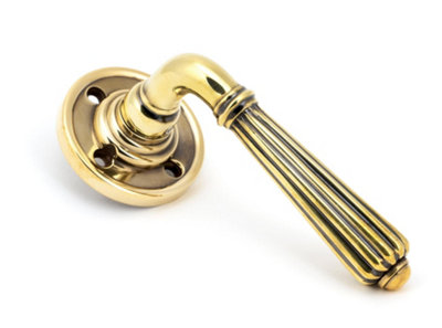 From The Anvil Aged Brass Hinton Lever On Rose Set from B&Q