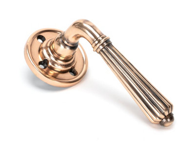 From The Anvil Polished Bronze Hinton Lever On Rose Set from B&Q