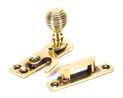 From The Anvil Aged Brass Beehive Sash Hook Fastener from B&Q