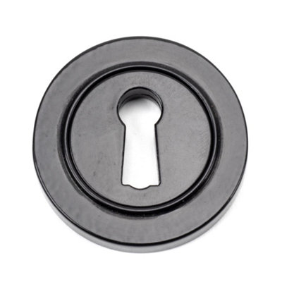 From The Anvil Black Round Escutcheon (Plain) from B&Q