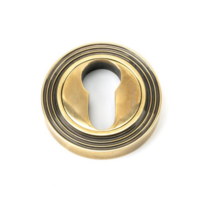 From The Anvil Aged Brass Round Euro Escutcheon (Beehive) from B&Q