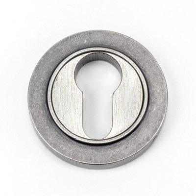 From The Anvil Pewter Round Euro Escutcheon (Plain) from B&Q