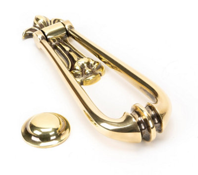 From The Anvil Aged Brass Loop Door Knocker from B&Q