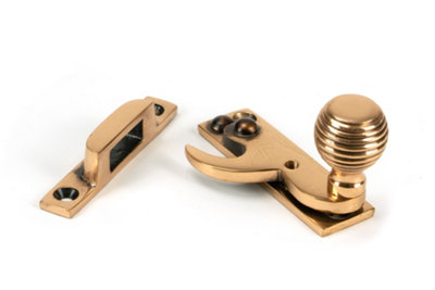 From The Anvil Polished Bronze Beehive Sash Hook Fastener from B&Q