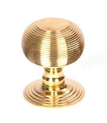 From The Anvil Polished Brass Beehive Centre Door Knob from B&Q
