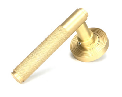 From the Anvil Satin Brass Brompton Lever On Rose Set (Beehive) from B&Q
