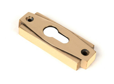 From the Anvil Aged Brass Art Deco Euro Escutcheon from B&Q