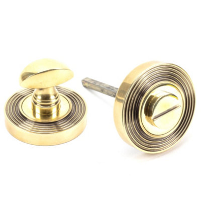 From The Anvil Aged Brass Round Thumbturn Set (Beehive) from B&Q