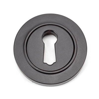 From The Anvil Aged Bronze Round Escutcheon (Plain) from B&Q