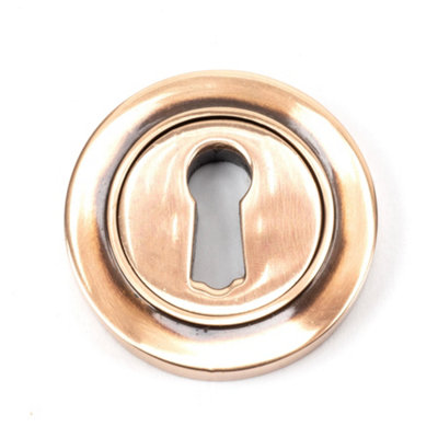 From The Anvil Polished Bronze Round Escutcheon (Plain) from B&Q