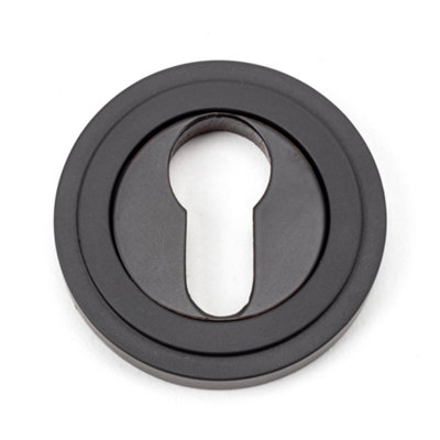 From The Anvil Aged Bronze Round Euro Escutcheon (Art Deco) from B&Q