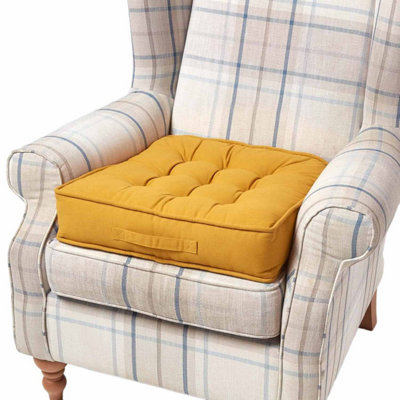 Homescapes Mustard Cotton Armchair Booster Cushion from B&Q