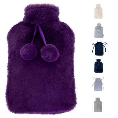 Livivo 2L Hot Water Bottle With Soft Insulating Purple Cover Featuring Decorative Pom Poms For Warmth Comfort And Pain Relief from B&Q